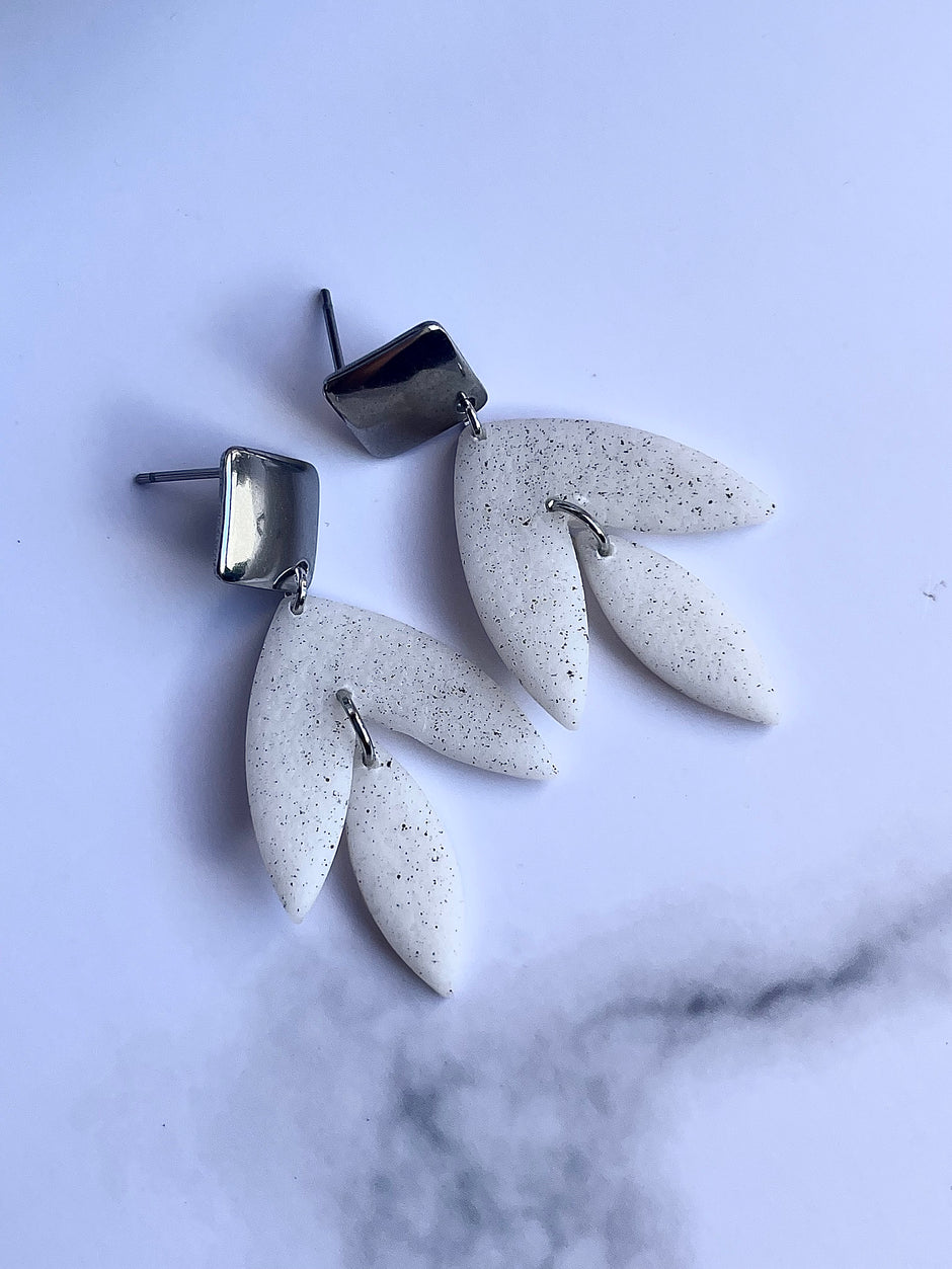 Matt textured leaf earrings with black speckles