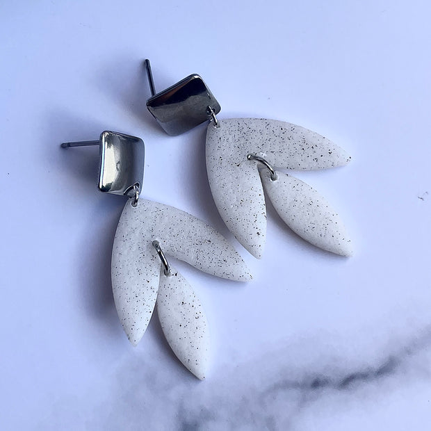 Matt textured leaf earrings with black speckles