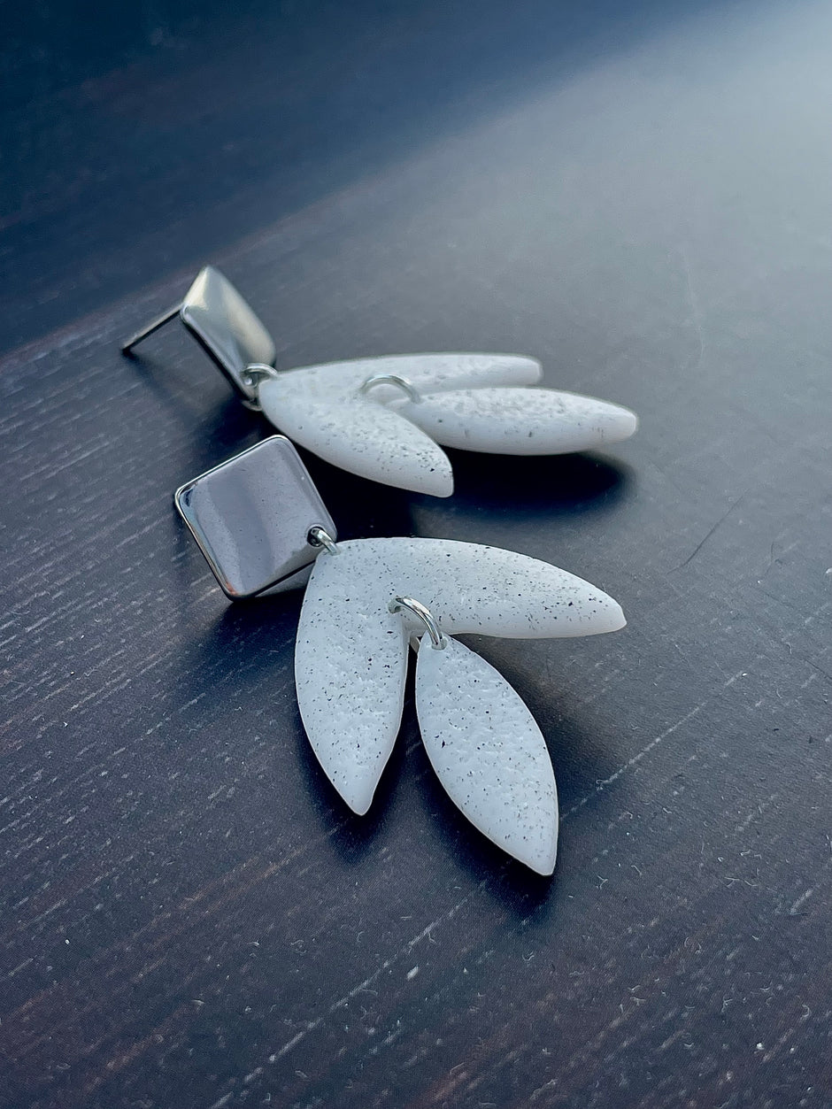 Matt textured leaf earrings with black speckles
