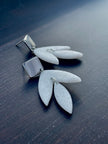 Matt textured leaf earrings with black speckles
