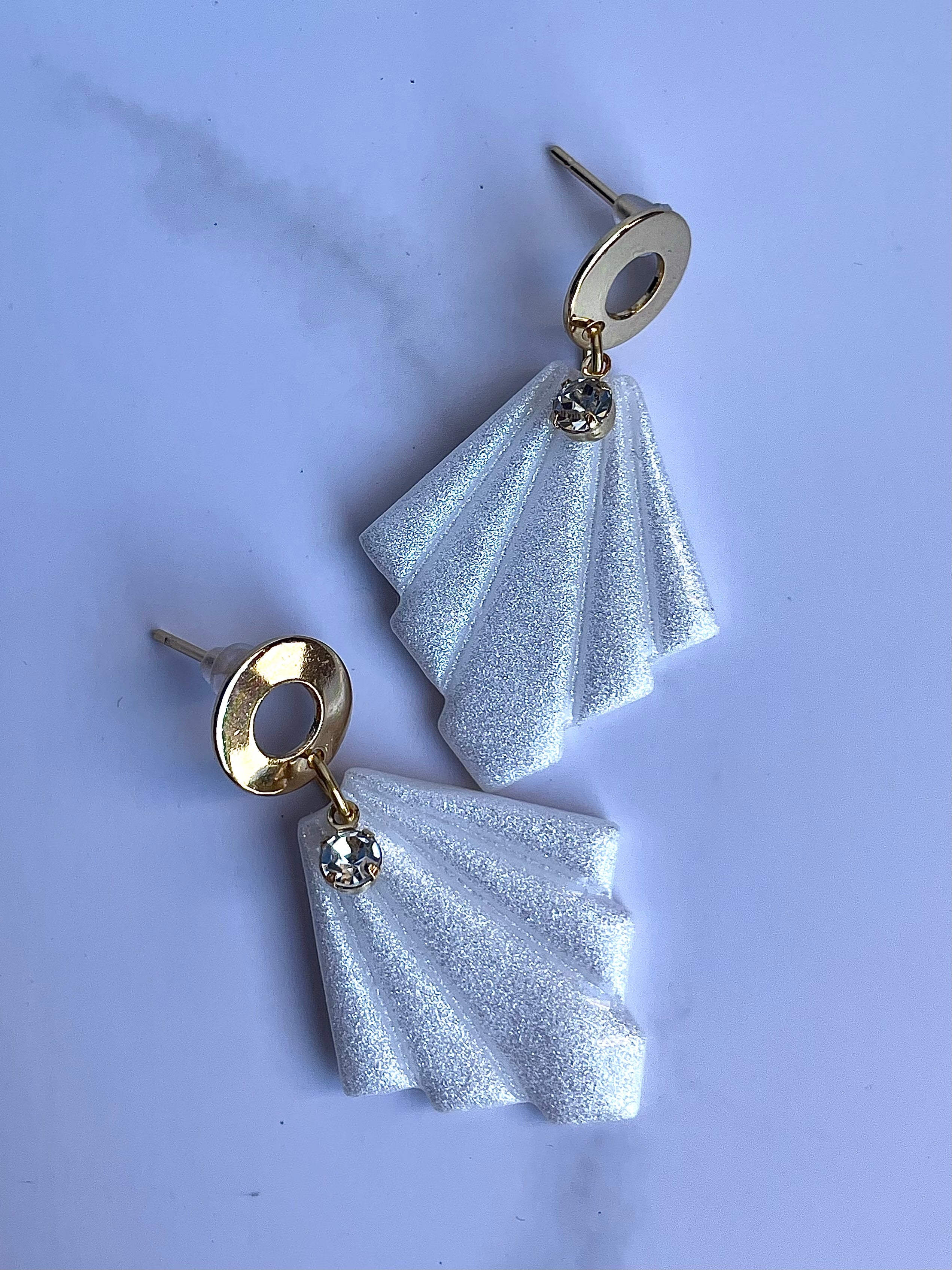 Glossy minimalistic earrings with pearl effect and zircon