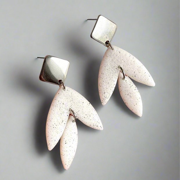 Matt textured leaf earrings with black speckles