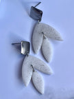 Matt textured leaf earrings with black speckles