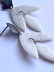 Matt textured leaf earrings with black speckles
