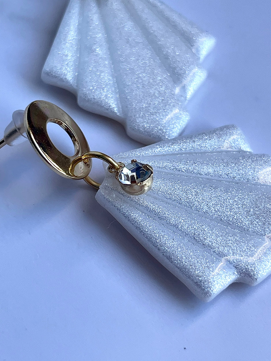 Glossy minimalistic earrings with pearl effect and zircon