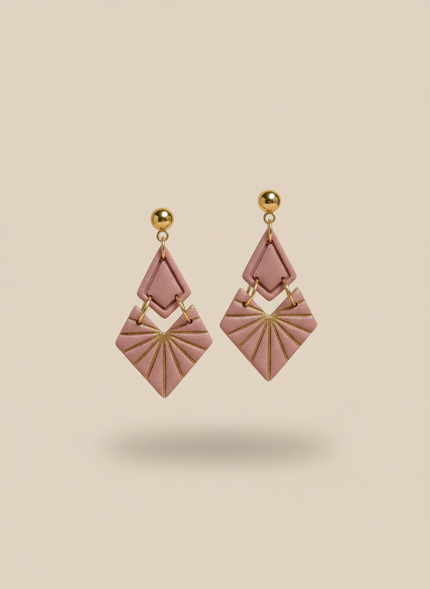 Dusty pink geometric earrings on beige background