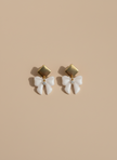 Earrings on neutral background