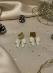 Earrings with Christmas-themed neutral background