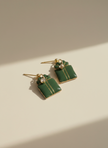 Green gift box earrings with professional studio background