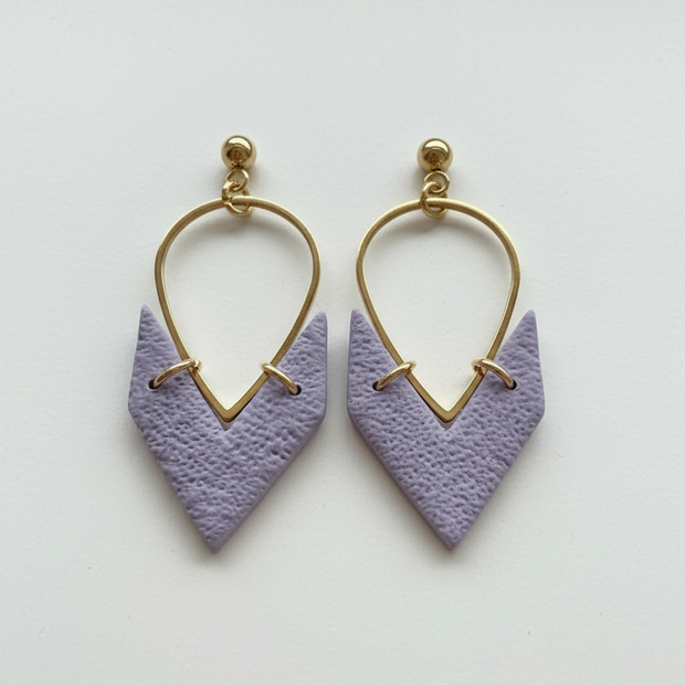 Lavender purple earrings on white background