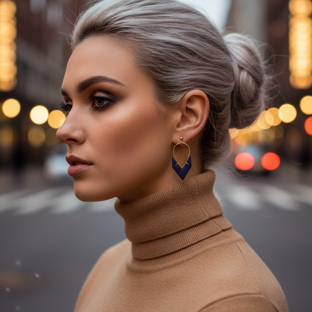Navy earrings with bokeh background - profile